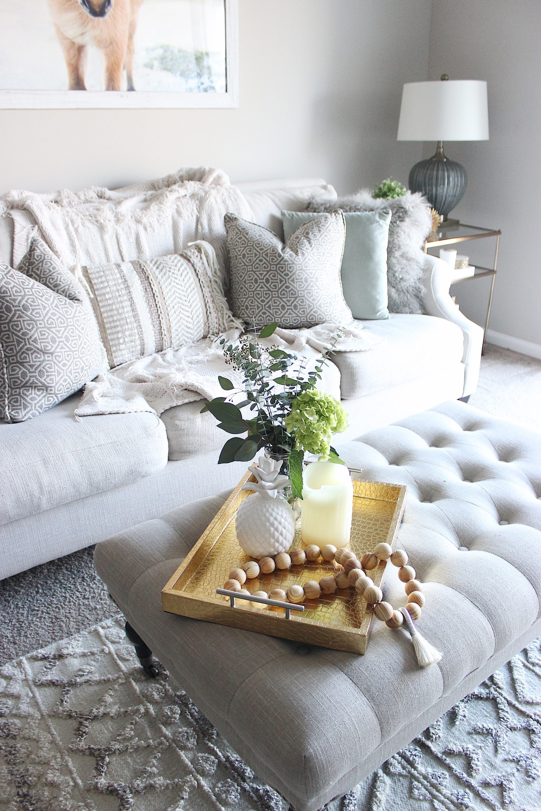 tufted ottoman neutral pillow living room style